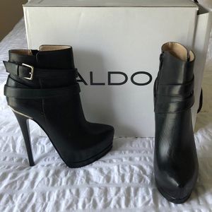 Black leather boots brand new in the box.